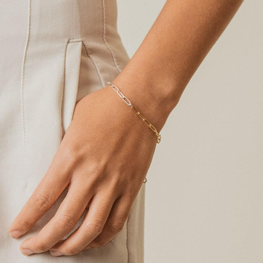 Mixed Metal Clip Chain Bracelet from Kolohe's Upcycled Collection. These jewelry pieces are sourced from extra raw material so every piece is sustainable in design. 14K Gold Fill and Sterling Silver Jewelry that is tarnish and water resistant.