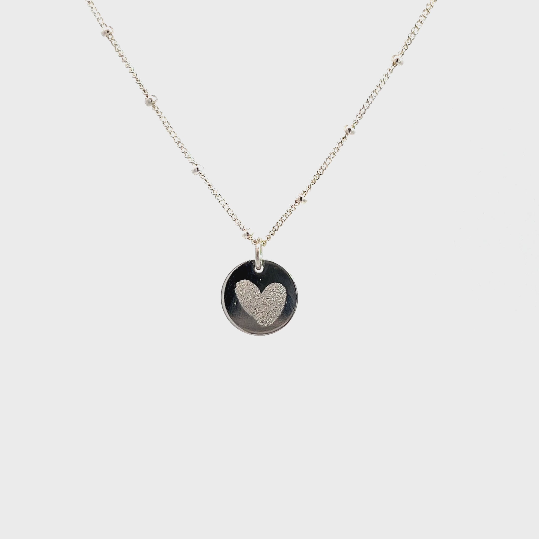 Sterling Silver Fingerprint Engraving. A unique gift idea for couples, family, and friends.