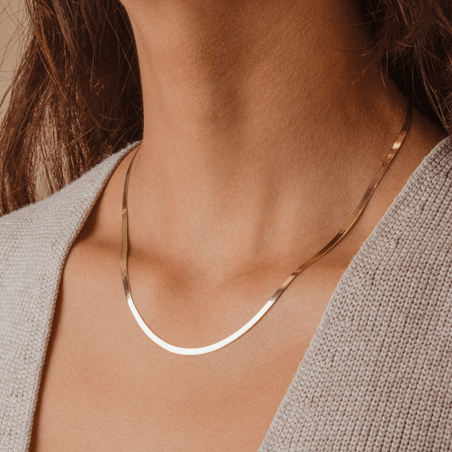 Minimal and gorgeous model wearing 14k Solid Gold Silk Chain Necklace, Trendy Herringbone Chain style