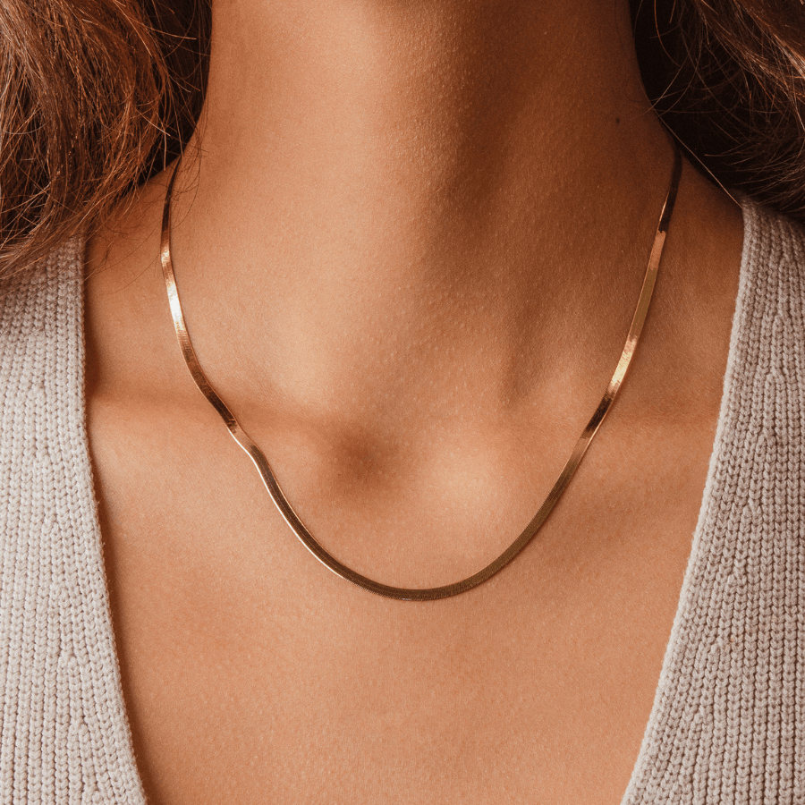 Minimal and gorgeous model wearing 14k Solid Gold Silk Chain Necklace, Trendy Herringbone Chain style