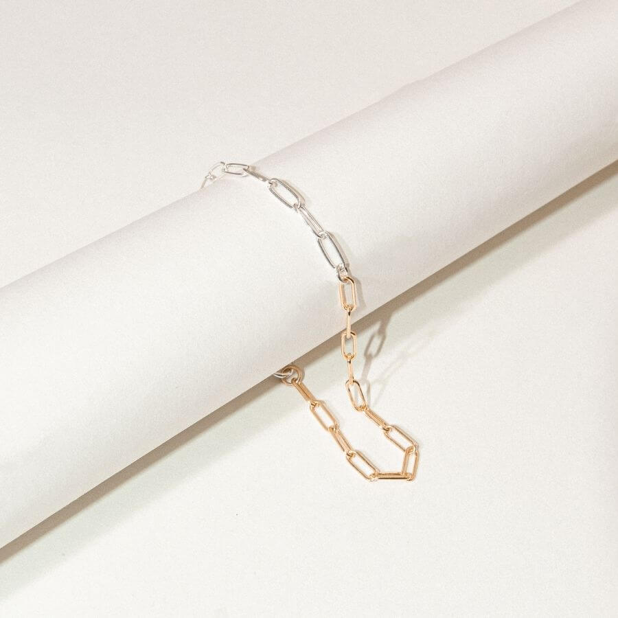 Mixed Metal Clip Chain Bracelet from Kolohe's Upcycled Collection. These jewelry pieces are sourced from extra raw material so every piece is sustainable in design. 14K Gold Fill and Sterling Silver Jewelry that is tarnish and water resistant.
