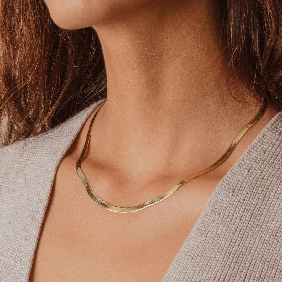 Model wearing 4mm Thick Solid Gold Herringbone Chain Layering Piece Statement Jewelry Water Resistant Trendy Jewelry